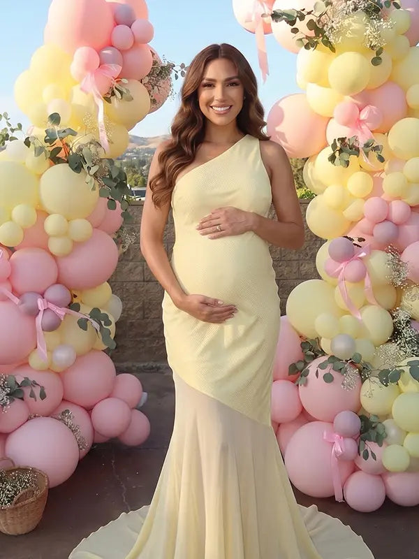 butter yellow one shoulder maternity maxi dress with open back and mesh hem