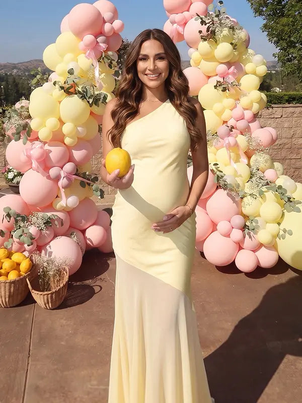 butter yellow one shoulder maternity maxi dress with open back and mesh hem