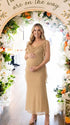 champagne beige maternity gown with draped neckline and cascading mesh ruffle details