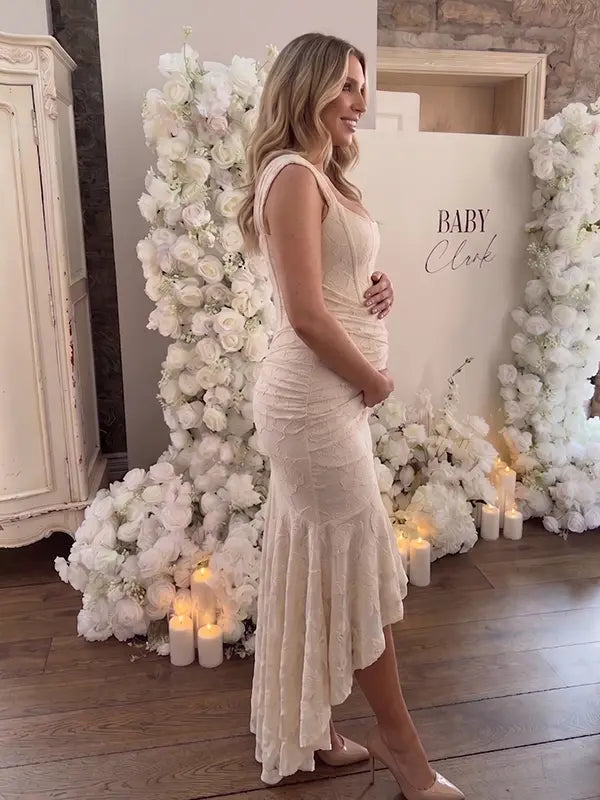 champagne jacquard maternity midi dress with corset bodice and high low hem