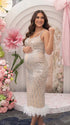 A champagne sequin feather trim maternity midi dress with illusion mesh, perfect for luxury maternity photoshoots, Gatsby baby showers, pregnancy announcements, and elegant formal celebrations.
