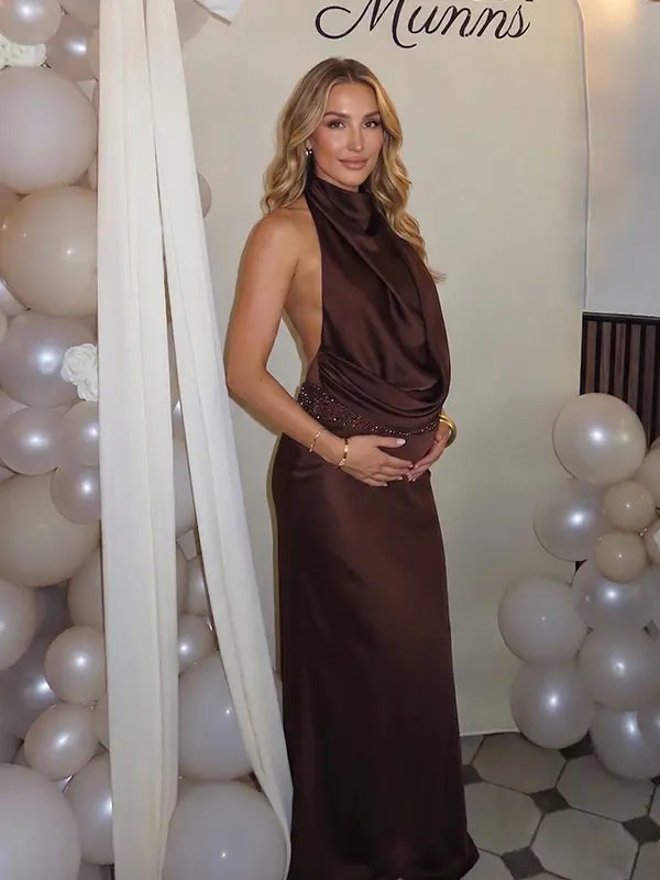 chocolate brown halter maternity gown with open back design and beaded waist detail