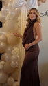 chocolate brown halter maternity gown with open back design and beaded waist detail