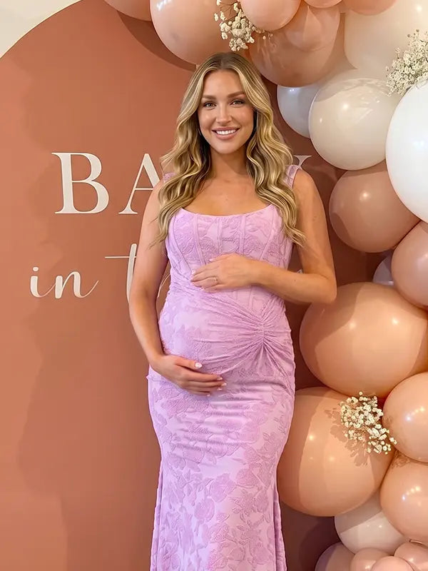 dusty lilac jacquard maternity midi dress with corset bodice and high low hem