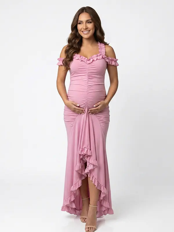 Dusty pink ruffle halter maternity maxi dress with flattering ruching and high-low hem for baby shower photoshoot