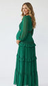 emerald green lace trim maternity maxi dress with long sleeves and tiered ruffle skirt