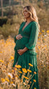emerald green lace trim maternity maxi dress with long sleeves and tiered ruffle skirt
