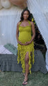 green ruffle maternity dress with halter neckline and asymmetrical frill hem