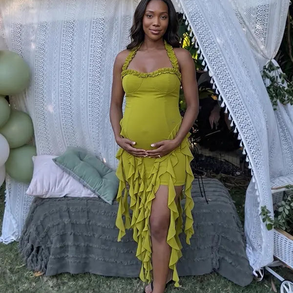 green ruffle maternity dress with halter neckline and asymmetrical frill hem