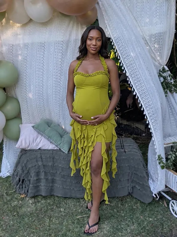 green ruffle maternity dress with halter neckline and asymmetrical frill hem
