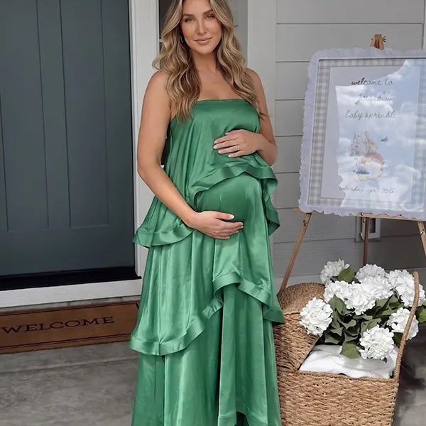 green tiered ruffle maternity maxi dress with spaghetti straps and layered ruffles