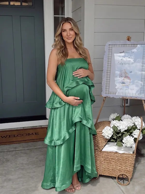 green tiered ruffle maternity maxi dress with spaghetti straps and layered ruffles
