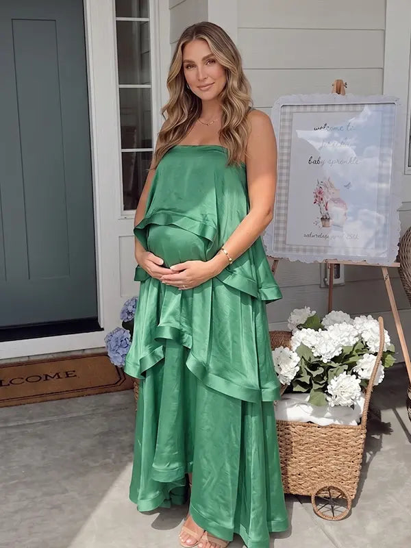 green tiered ruffle maternity maxi dress with spaghetti straps and layered ruffles