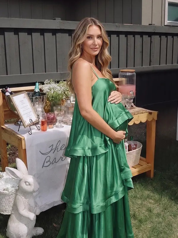 green tiered ruffle maternity maxi dress with spaghetti straps and layered ruffles