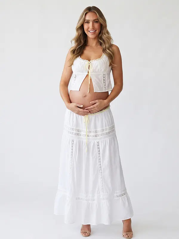 Ivory Boho Lace Two Piece Maternity Photoshoot Outfit Featuring a Tie Front Crop Top and Flowing Tiered Maxi Skirt for Boho Pregnancy Photography, Beach Maternity Sessions and Pregnancy Announcements | Bumplook