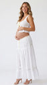 Ivory Boho Lace Two Piece Maternity Photoshoot Outfit Featuring a Tie Front Crop Top and Flowing Tiered Maxi Skirt for Boho Pregnancy Photography, Beach Maternity Sessions and Pregnancy Announcements | Bumplook