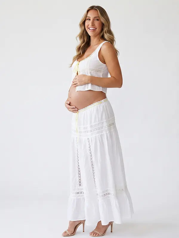 Ivory Boho Lace Two Piece Maternity Photoshoot Outfit Featuring a Tie Front Crop Top and Flowing Tiered Maxi Skirt for Boho Pregnancy Photography, Beach Maternity Sessions and Pregnancy Announcements | Bumplook
