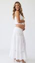 Ivory Boho Lace Two Piece Maternity Photoshoot Outfit Featuring a Tie Front Crop Top and Flowing Tiered Maxi Skirt for Boho Pregnancy Photography, Beach Maternity Sessions and Pregnancy Announcements | Bumplook
