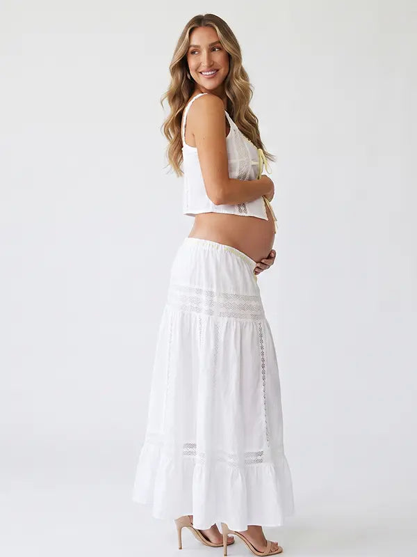 Ivory Boho Lace Two Piece Maternity Photoshoot Outfit Featuring a Tie Front Crop Top and Flowing Tiered Maxi Skirt for Boho Pregnancy Photography, Beach Maternity Sessions and Pregnancy Announcements | Bumplook