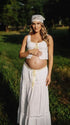 Ivory Boho Lace Two Piece Maternity Photoshoot Outfit Featuring a Tie Front Crop Top and Flowing Tiered Maxi Skirt for Boho Pregnancy Photography, Beach Maternity Sessions and Pregnancy Announcements | Bumplook