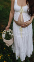 Ivory Boho Lace Two Piece Maternity Photoshoot Outfit Featuring a Tie Front Crop Top and Flowing Tiered Maxi Skirt for Boho Pregnancy Photography, Beach Maternity Sessions and Pregnancy Announcements | Bumplook