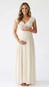 Pregnant model wearing an ivory lace chiffon maternity maxi dress with floral lace bodice, flutter sleeves and flowing skirt for boho baby shower, maternity photoshoot and bridal celebration.