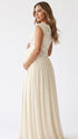 An ivory lace chiffon maternity maxi dress with floral lace bodice, flutter sleeves and flowing skirt for boho baby shower, maternity photoshoot and bridal celebration.
