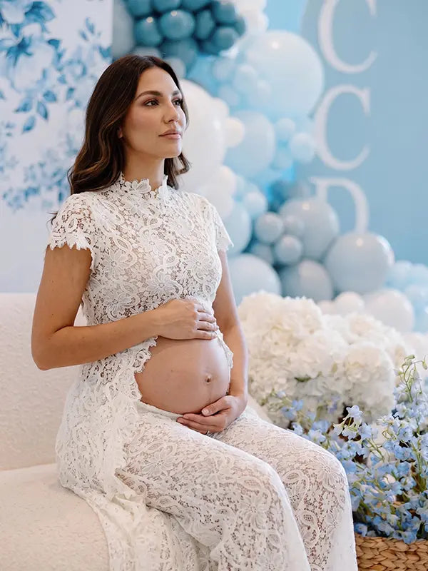 Ivory Lace Two Piece Maternity Photoshoot Pants Set with High Neck Crop Top, Open Belly Design and Wide Leg Pants for Pregnancy Announcement, Studio Portrait, Baby Shower and Fine Art Maternity Photography | Bumplook