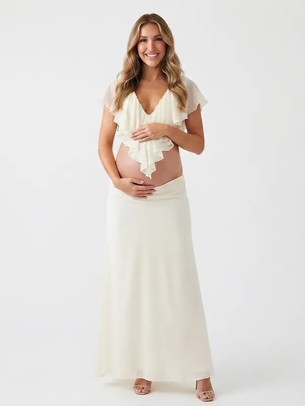 Ivory Ruffle Two Piece Maternity Photoshoot Outfit Featuring an Open Belly Design and Flowing Maxi Skirt for Pregnancy Photography, Studio Maternity Portraits and Pregnancy Announcements | Bumplook