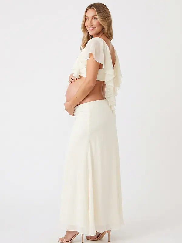 Ivory Ruffle Two Piece Maternity Photoshoot Outfit Featuring an Open Belly Design and Flowing Maxi Skirt for Pregnancy Photography, Studio Maternity Portraits and Pregnancy Announcements | Bumplook