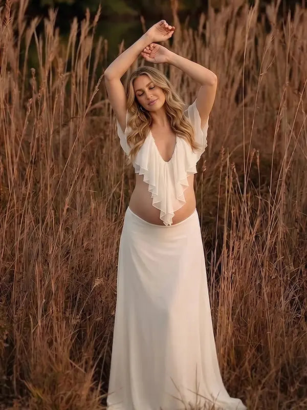 Ivory Ruffle Two Piece Maternity Photoshoot Outfit Featuring an Open Belly Design and Flowing Maxi Skirt for Pregnancy Photography, Studio Maternity Portraits and Pregnancy Announcements | Bumplook