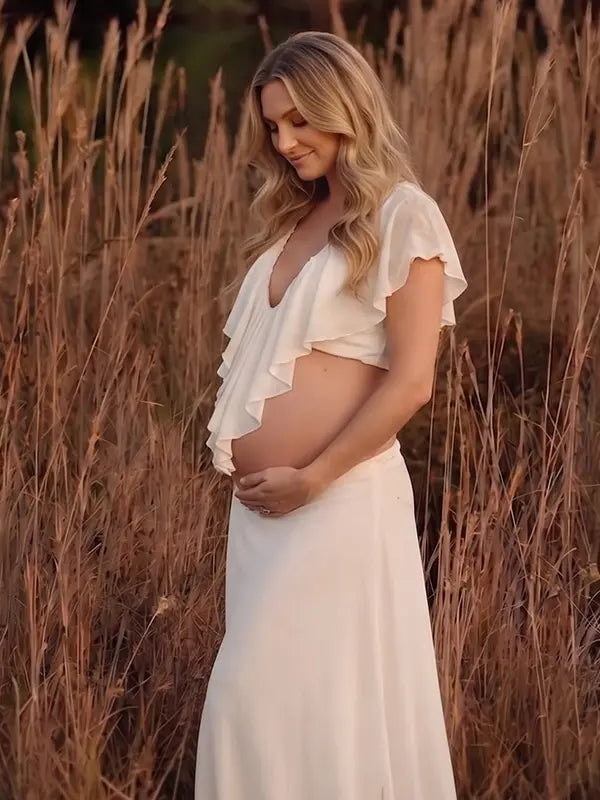 Ivory Ruffle Two Piece Maternity Photoshoot Outfit Featuring an Open Belly Design and Flowing Maxi Skirt for Pregnancy Photography, Studio Maternity Portraits and Pregnancy Announcements | Bumplook