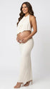 Minimalist Ivory Maternity Outfit Featuring a Halter Neck Top and Bodycon Maxi Skirt for Fine Art Pregnancy Photoshoots and Editorial Maternity Photography | Bumplook