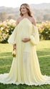 Pregnant model wearing boho light yellow maternity gown and showing baby bump for photoshoot