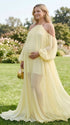 Side view of pregnant woman wearing light yellow maternity dress for baby shower and photoshoot 