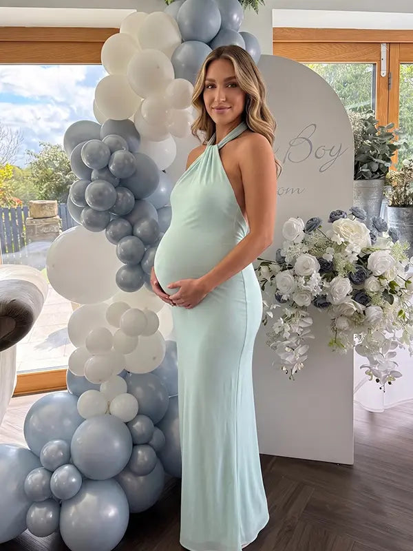 mint green halter maternity maxi dress with open back bodycon silhouette
