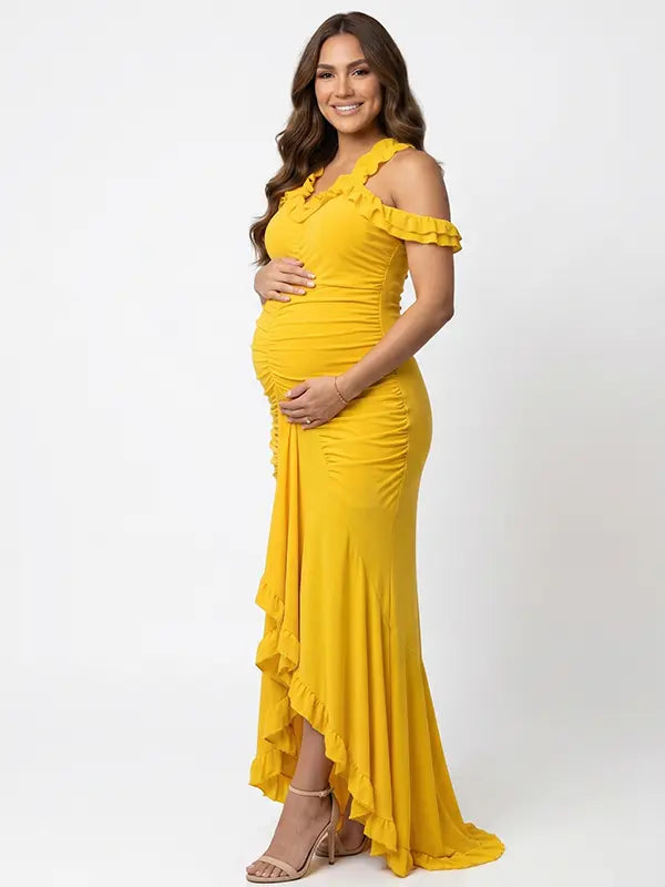 Mustard yellow ruffle halter maternity maxi dress with ruched bodycon silhouette and flowing high-low hem