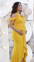 Mustard yellow ruffle halter maternity maxi dress with ruched bodycon silhouette and flowing high-low hem