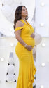 Mustard yellow ruffle halter maternity maxi dress with ruched bodycon silhouette and flowing high-low hem