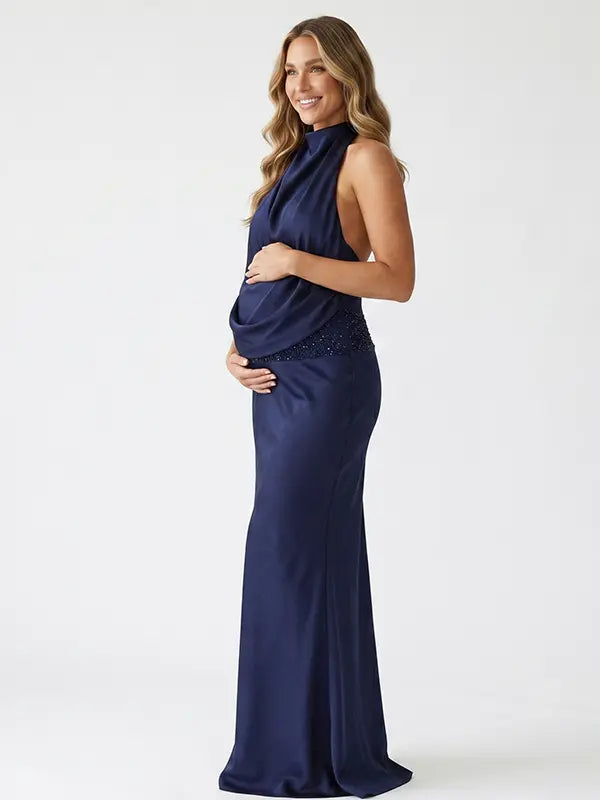 navy blue halter maternity gown with open back design and sequin waist detail