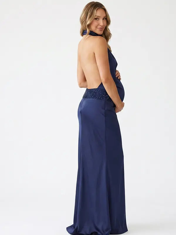 navy blue halter maternity gown with open back design and sequin waist detail