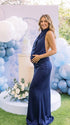 navy blue halter maternity gown with open back design and sequin waist detail