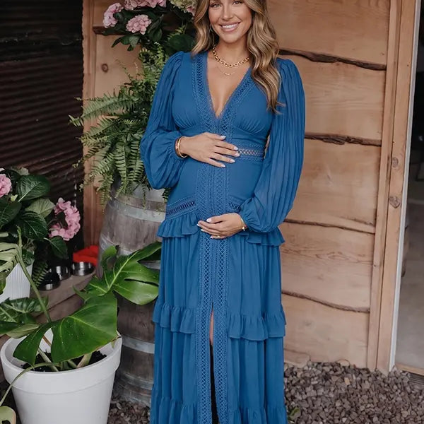 navy blue lace trim maternity maxi dress with long sleeves and flowing tiered skirt