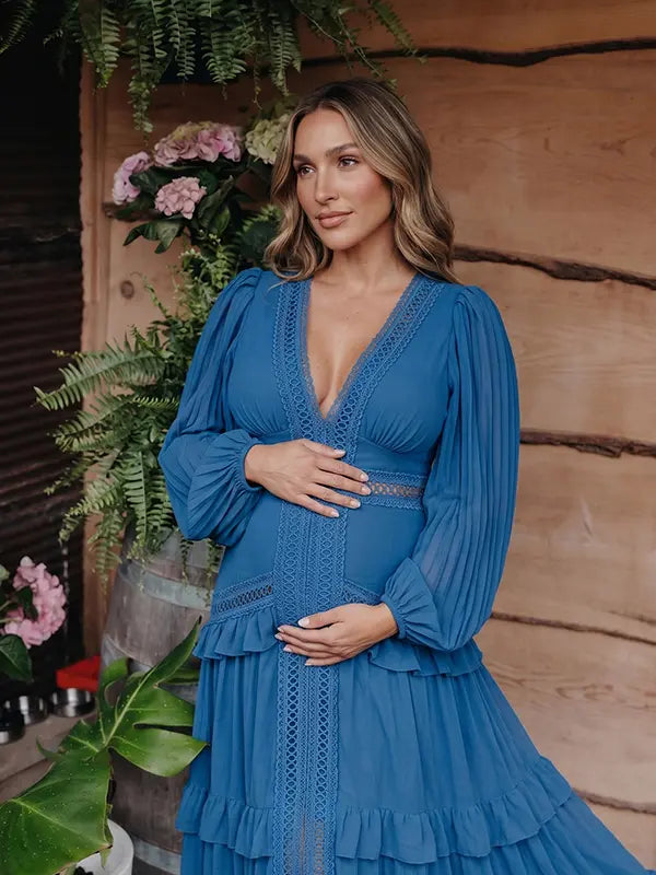 navy blue lace trim maternity maxi dress with long sleeves and flowing tiered skirt