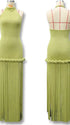 Olive green fringe halter maternity maxi dress with tassel hem, bodycon pregnancy gown for boho baby shower, rustic maternity photoshoot, outdoor pregnancy photography, and nature-inspired maternity portraits.