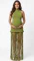 Olive green fringe halter maternity maxi dress with tassel hem, bodycon pregnancy gown for boho baby shower, rustic maternity photoshoot, outdoor pregnancy photography, and nature-inspired maternity portraits.