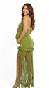 Olive green fringe halter maternity maxi dress with tassel hem, bodycon pregnancy gown for boho baby shower, rustic maternity photoshoot, outdoor pregnancy photography, and nature-inspired maternity portraits.