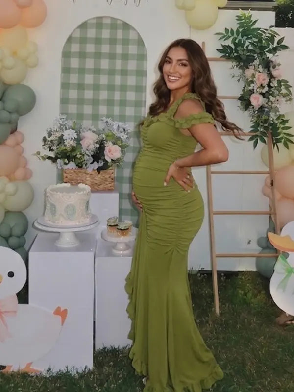 Olive green ruffle halter maternity maxi dress with ruched bodycon fit and flowing high-low hem