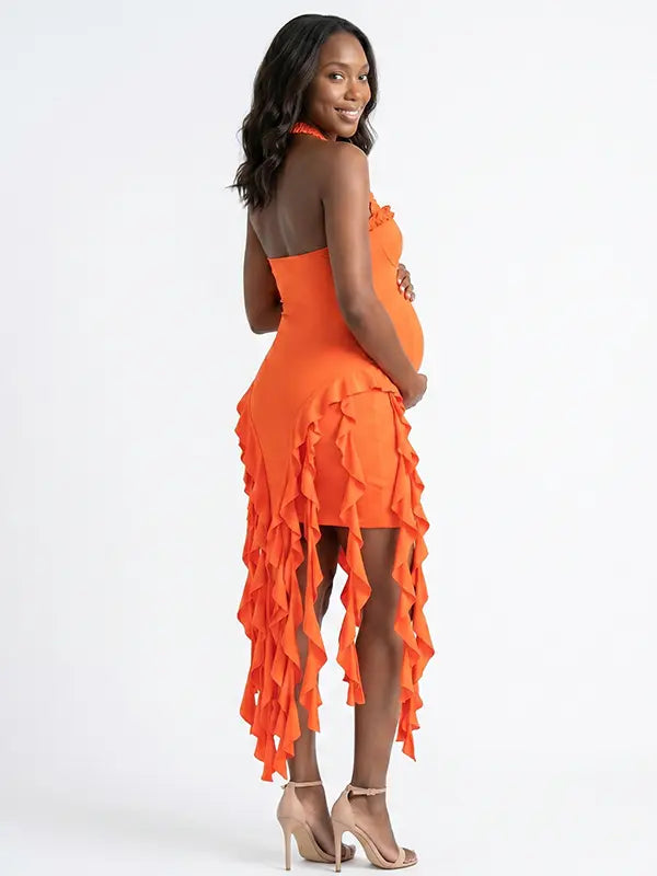 orange ruffle maternity dress with halter neckline and asymmetrical frill hem