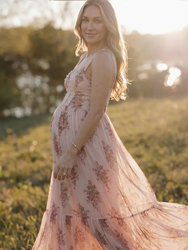 pink floral corset maternity maxi dress with full skirt and structured bodice